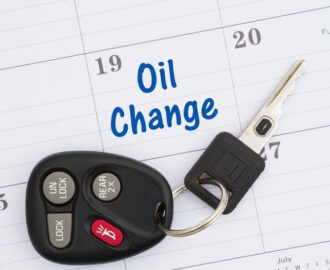 note on a calendar to get an oil change with car keys on calendar Smoky Hill Auto Service